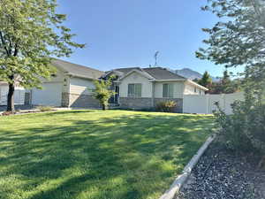 View of front of property featuring brick  and siding and an attached garage set on a quiet cut-de-sac in a quaint town