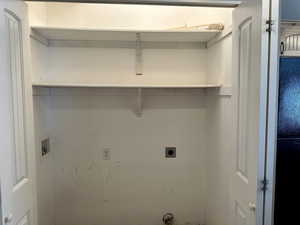 Washroom with hookup for a washing machine and hookup for an electric dryer