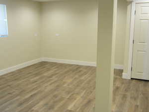 Below grade area with wood finished floors and baseboards