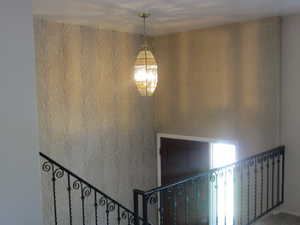 Stairway with wallpapered walls