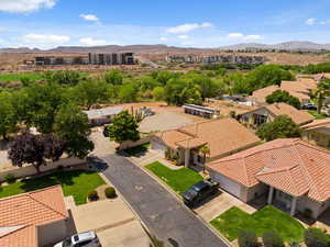 Aerial perspective of suburban area with a mountainous background