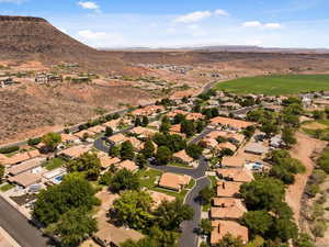 Aerial overview of property's location featuring nearby suburban area and mountains