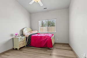 Bedroom featuring light wood finished floors and a ceiling fan