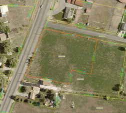 Aerial map of property and surrounding area featuring property parcel outlined