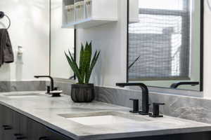 Full bathroom featuring double vanity