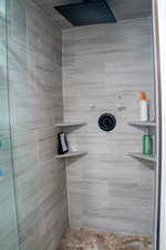 Bathroom featuring a tile shower