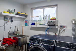 Laundry room featuring washer and clothes dryer