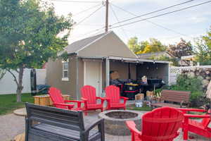 View of patio featuring a fire pit
