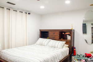 Bedroom with recessed lighting