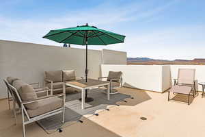 View of patio / terrace featuring outdoor lounge area and a mountain view