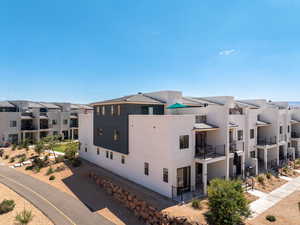 View of property with a residential view