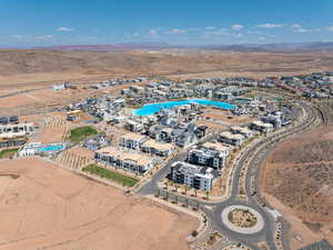 Aerial overview of property's location featuring a desert landscape and a mountainous background