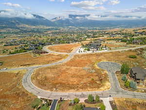 Aerial overview of property's location with a mountainous background