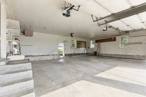 Garage featuring a garage door opener