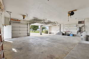 Garage with a heating unit and a garage door opener