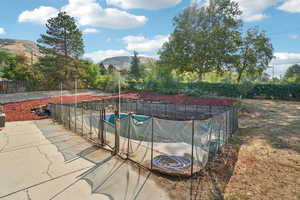 View of pool featuring a mountain view and a patio area