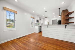 Unfurnished living room with light wood-type flooring and recessed lighting