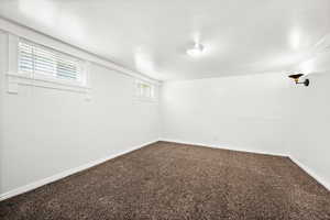 Basement with carpet and baseboards