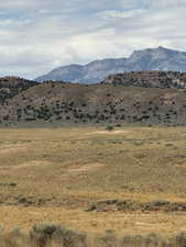 View of mountain backdrop featuring rural landscape
