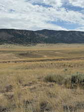 View of mountain background featuring rural landscape