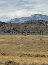 View of mountain backdrop featuring rural landscape