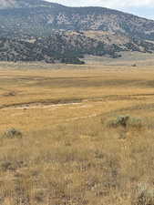 View of mountain backdrop with rural landscape