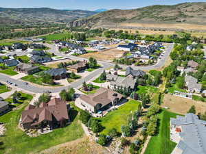 View of property location featuring nearby suburban area and a mountain backdrop