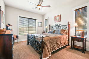 Bedroom featuring baseboards and a ceiling fan