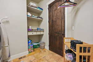 Laundry area featuring baseboards