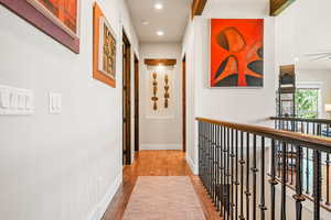 Hall with recessed lighting and light wood-type flooring