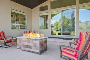 View of patio with a fire pit