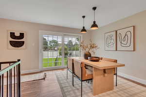 Dining room featuring baseboards and light wood-type flooring