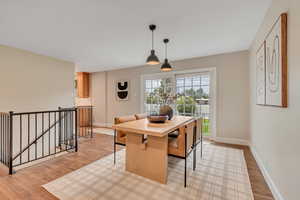 Dining area featuring light wood-style floors