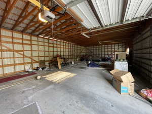 Garage with metal wall and a garage door opener