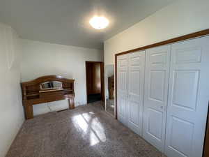 Unfurnished bedroom featuring a closet and carpet flooring