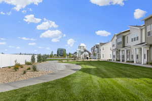 View of home's community featuring a lawn and a residential view