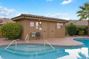 Community pool featuring a patio
