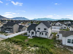Aerial view of residential area featuring a mountainous background