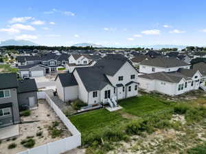 Aerial perspective of suburban area featuring a mountain backdrop