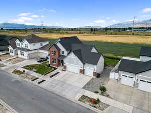 Overview of rural landscape featuring a mountainous background