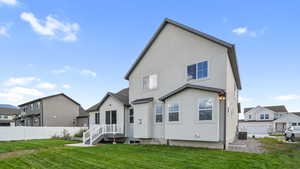 Back of property featuring a residential view and stucco siding