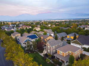 Aerial perspective of suburban area with a mountainous background