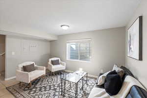 Living area with tile patterned floors and baseboards