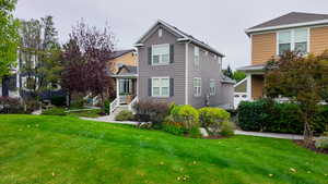 Traditional-style house with a front yard