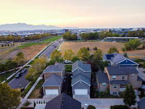 Aerial view at dusk of a residential view and a mountain view