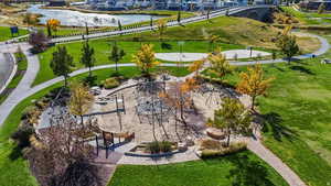 Aerial view of residential area with a nearby body of water and a recreational park