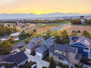Aerial view of residential area featuring a mountain backdrop