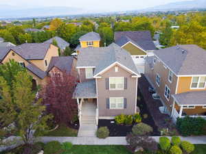 Aerial perspective of suburban area with a mountainous background