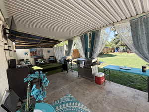 Fenced backyard with a patio area and area for grilling