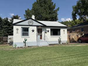 View of front of home featuring a chimney